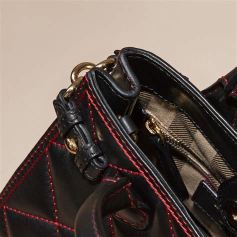 burberry women's baby banner quilted lambskin mini tote black red|burberry mini rocking horse bag.